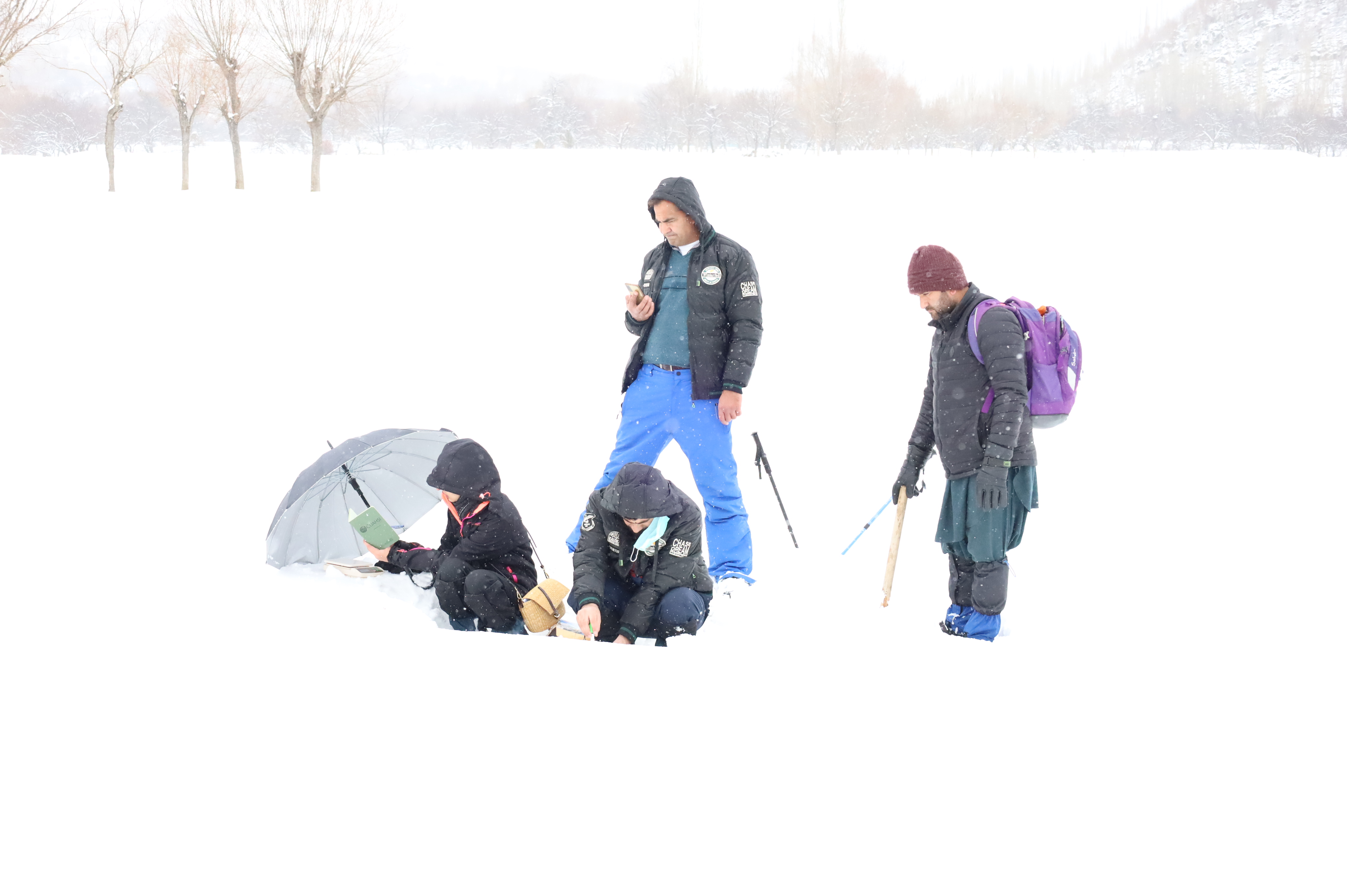 WIT team members collecting snow samples