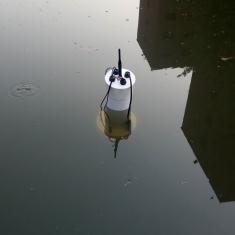 Floating water quality sensor during an experiment in a pond in Lahore
