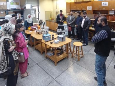 students engaging with lab staff at wit